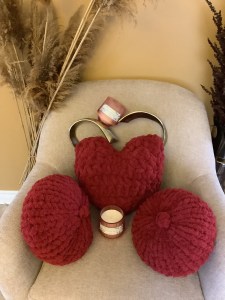 Heart and matching Pumpkin finger-knit cushions
